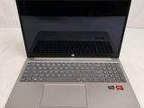an open laptop computer sitting on top of a white surface