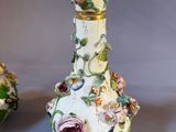 two vases that have been decorated with flowers on them