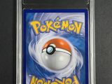 a close up of a pokemon card in a plastic case