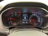 the dashboard of a car with two speedometers and a dash light