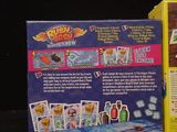 a box with a card game inside of it on a table