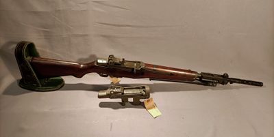 two guns are sitting on a table next to each other