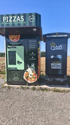 two vending machines on the side of the road