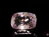 an image of a pink diamond on a black surface