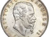 Gros plan sur une pièce de monnaie portant le visage d'un homme