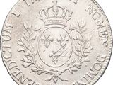 a close up of a coin with a crown on it