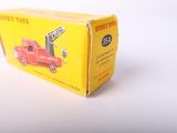 a red toy truck that is sitting in a box