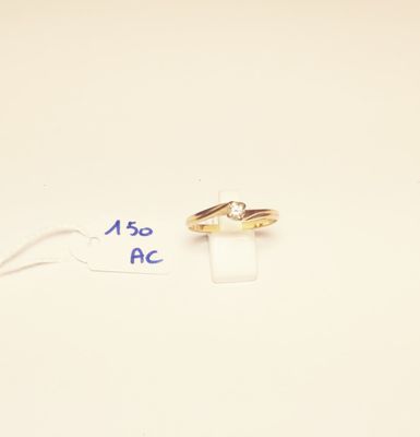two wedding rings sitting on top of a piece of paper