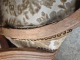 a close up of a chair with a chain on it