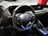 the interior of a car with a steering wheel, dashboard, and dash board