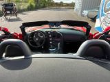 a view of a sports car from the inside of the car