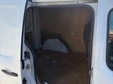 a white van with the door open on the side of the road