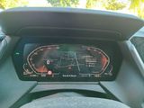 the dashboard of a car with a digital display on it