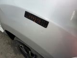 a close up of a car with a sticker on it ' s bumper