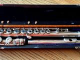 a flute that is sitting in a case on a table