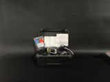 a black suitcase with a bunch of items inside of it