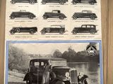 a poster of old cars on the wall of a building