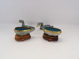 pair of blue and gold painted ducks on wooden stands