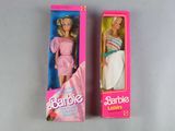 barbie doll in a pink box and a barbie doll in a pink box