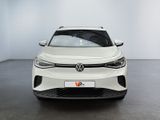 a white volkswagen suv parked in a room with a white wall