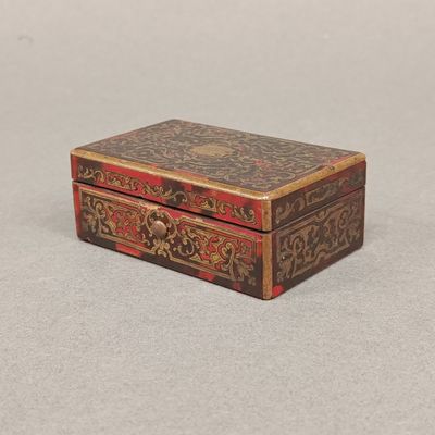 an image of a small wooden box sitting on top of a table