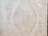 a white cloth with a design on it on a black surface