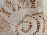close up of a piece of lace on a piece of cloth