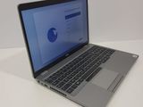 an open laptop computer sitting on top of a white table