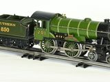 a model train on a track with a white background