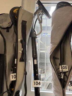 two backpacks that are sitting next to each other