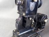 an old camera that is sitting on a stand