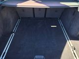 a trunk of a car with the back seats folded down