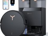 a close up of a black coffee machine next to a smart phone