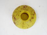 a yellow vase that has a brown spot on it