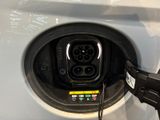a close up of an electric car being charged