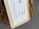 a gold christmas tree with a price tag attached to it