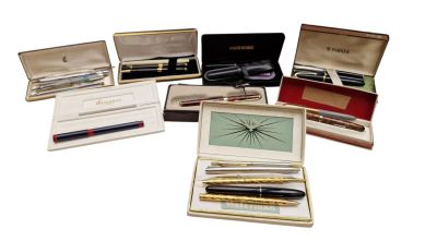 a lot of pens and other items in a box