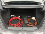 a trunk of a car with a bunch of wires in it
