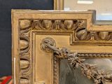a picture of a gold picture frame on a table