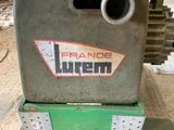 a machine that is sitting on the ground with a sign on it