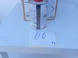a white table with a red lid and a box on it