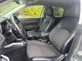 the interior of a car with two seats and a steering wheel
