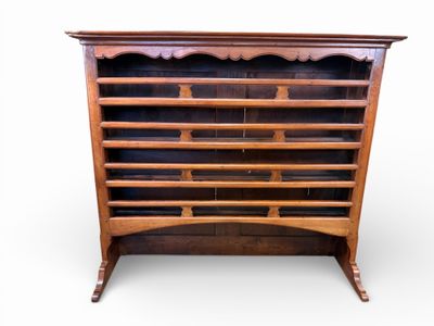an antique oak bookcase with glass doors and shelves