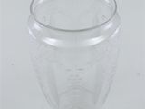 a clear glass vase with a pattern on it