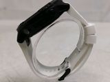 a watch that is sitting on top of a clear stand