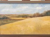 a painting of a field of yellow grass on a table