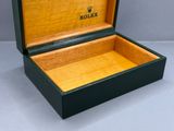 a box with a watch inside of it on a table