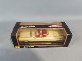 a box with a toy car inside of it on a white surface
