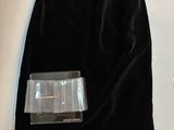 the skirt is black and has a silver buckle on the front