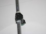 a metal pipe that has a black bag on it